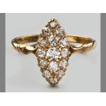 AN 18CT YELLOW GOLD AND DIAMOND RING, fifteen rose-cut diamonds in lozenge form on a solid shank,