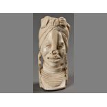 AN AFRICAN CARVED IVORY BUST OF A WOMAN, in traditional head dress and earrings, 21cm high.