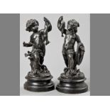 A PAIR OF MID-20TH CENTURY SPELTER FIGURES OF PUTTI, one holding a fish, the other a fox, on