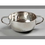 A GEORGE V SILVER PORRINGER, SHEFFIELD 1930, C.B. &S., fold-over rim, twin handles, plain body on