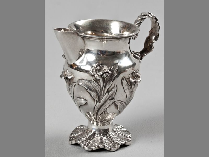 A WILLIAM IV SILVER CREAMER, LONDON 1834, CHARLES THOMAS FOX, fold-over rim, applied embossed leaf