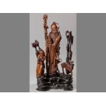 AN IMPOSING 19TH CENTURY CHINESE WOOD CARVING OF A SAGE, holding a staff with attendant and deer,