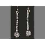 A PAIR OF 9CT WHITE GOLD AND DIAMOND EARRINGS, three segmented horizontal bars, each set with
