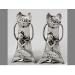 A PAIR OF WMF ART NOUVEAU VASES, of triangular form, the top embossed with flowers, graduated body