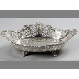 AN EDWARDIAN SILVER PIERCED BOWL, BIRMINGHAM 1909, W.A., applied scroll and floral form serpentine