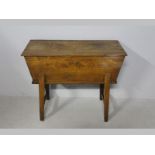 A LATE 18TH CENTURY ENGLISH OAK DOUGH BIN, of sarcophagus form with a singl plank top standing on
