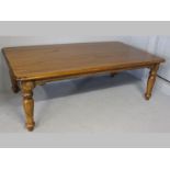 A PIERRE CRONJE CAPE HARDWOOD RECTANGULAR DINING TABLE, the top with a moulded edge and re-entrant