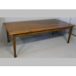 A PIERRE CRONJE CAPE COUNTRY YELLOWWOOD AND BASSWOOD DINING TABLE, the rectangular top with a