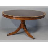 A PIERRE CRONJE CIRCULAR MAHOGANY DINING TABLE, the well figured top cross banded with maple,