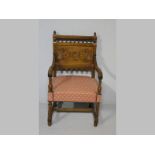 A WALNUT ARMCHAIR, in the 17th Century manner, the top-rail with finials and bobbins above a