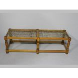 A 17TH CENTURY STYLE CAPE YELLOWWOOD LONG RIEMPIES STOOL, the moulded top-rails strung with