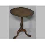 A LATE VICTORIAN MAHOGANY PIE-CRUST TABLE, the scalloped top standing on a turned and twisted column