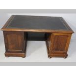 A VICTORIAN MAHOGANY PEDESTAL PARTNERS DESK, the moulded top inlaid with a gilt tooled leather