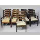 A SET OF NINE PIERRE CRONJE MAHOGANY LADDERBACK DINING CHAIRS, with slight stylistic differences,