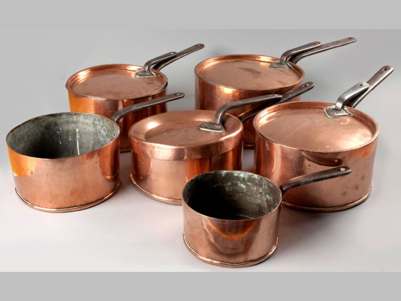 A SET OF SIX EARLY 19TH CENTURY GRADUATED CONTINENTAL COPPER SAUCE PANS, each with dove tailed