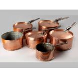 A SET OF SIX EARLY 19TH CENTURY GRADUATED CONTINENTAL COPPER SAUCE PANS, each with dove tailed