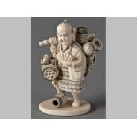 A 20TH CENTURY JAPANESE STAINED IVORY FIGURE OF A BASKET SELLER, 18cm high.