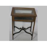 AN EDWARDIAN MAHOGANY VITRINE TABLE, the rectangular top and sides with glazed panels, standing on