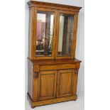 A VICTORIAN MAHOGANY CABINET BOOKCASE, the upper-section with a stepped pediment above two