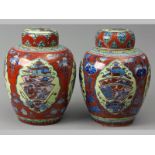 A RARE PAIR OF CHINESE KANGXI PERIOD GINGER JARS AND DOMED COVERS, CIRCA 1680, originally