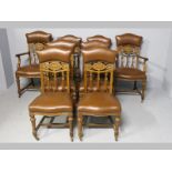 A SET OF EIGHT MAHOGANY DINING CHAIRS, incorporating two carvers, the padded leather top-rails above