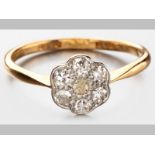 AN 18ct YELLOW GOLD AND DIAMOND RING, seven rose-cut diamonds in milgrain setting of floral form,