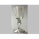 A LARGE 18TH CENTURY ENGLISH GLASS GOBLET, first half of the 18th century the stem has a triple