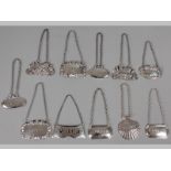A COLLECTION OF ELEVEN SILVER DECANTER LABLES, various dates and makers, to include; Whiskey, Vodka,