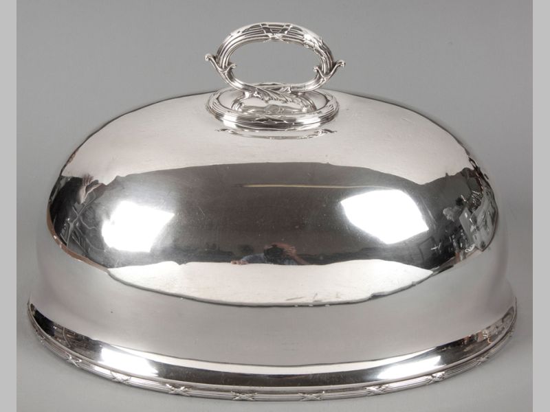 A SILVERPLATE MEAT DOME, by James Dixon & Sons, removable handle moulded with leaf decoration, plain