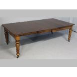 A VICTORIAN MAHOGANY EXTENDING DINING TABLE, the moulded top with leaves supported on a telescopic