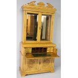 AN EDWARDIAN OAK ESCRETOIRE BOOKCASE, the carved broken arch pediment above two rectangular glazed