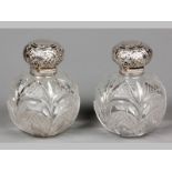 A PAIR OF VICTORIAN CUT-GLASS AND SILVER TOP PERFUUM BOTTLES, CHESTER 1896, MAKERS MARKS