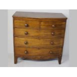 A GEORGE III MAHOGANY BOW FRONTED CHEST OF DRAWERS, the flush top above two short and three long