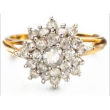 AN 18ct YELLOW GOLD AND DIAMOND RING, twenty-five brilliant cut diamonds in claw setting in a
