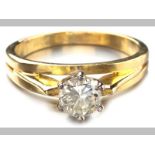 AN 18ct YELLOW GOLD AND DIAMOND SOLITAIRE, round brilliant cut diamond in claw setting, raised and