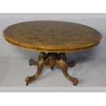 A VICTORIAN WALNUT AND BURR WALNUT OVAL TABLE, the quarter veneerd top inlaid with banding and