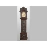 A VICTORIAN STAINED OAK LONGCASE CLOCK, with a crested hood waisted trunk and box base, the entire