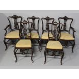 A SET OF SIX EDWARDIAN MAHOGANY DINING CHAIRS, retailed by W. Whiteley, London. Comprising four