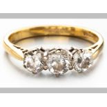 AN 18ct YELLOW GOLD AND DIAMOND RING, three round brilliant cut diamonds in claw settings ending