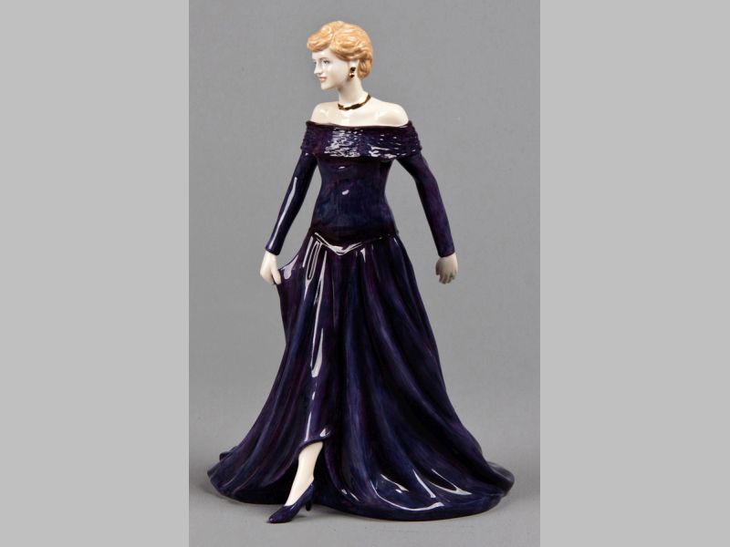 A ROYAL DOULTON "DIANA PRINCESS OF WALES" FIGURINE, dressed in a royal blue evening gown, base