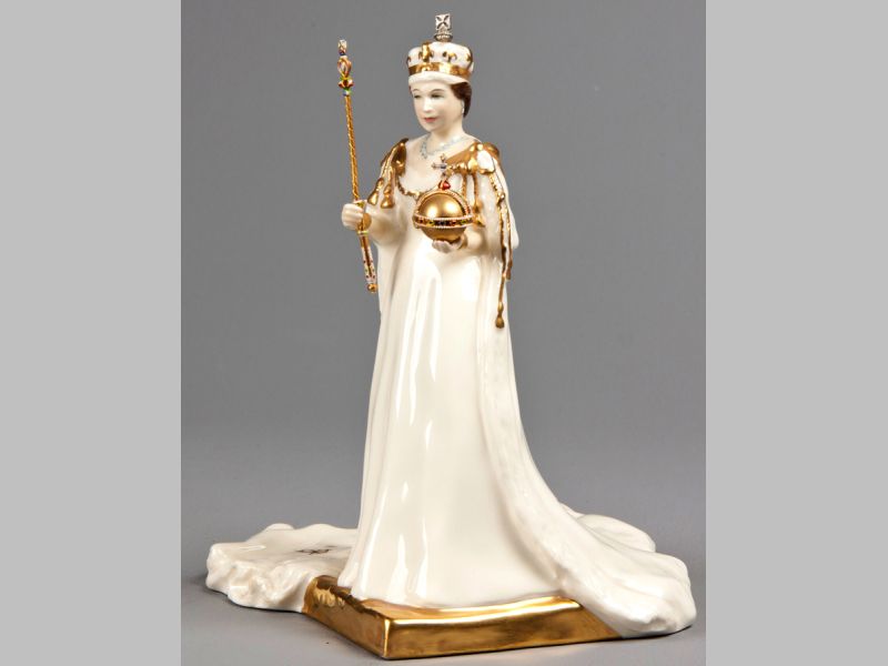 A ROYAL DOULTON "HER MAJESTY QUEEN ELIZABETH II" FIGURINE, to commerate the Golden Jubilee, base