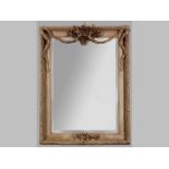 A RECTANGULAR MIRROR, the frame decorated with foliage and ribbons, housing a bevelled plate, (