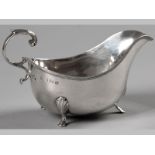 A GEORGE V SILVER SAUCE BOAT, BIRMINGHAM 1919, J.R., with applied scroll handle, reeded rim, on