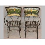 A PAIR OF WROUGHT IRON ARMCHAIRS, the backs depicting a golfing scene with scrolled arms above