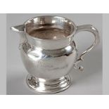 A VICTORIAN SILVER CREAMER, LONDON 1868, J.R., fold-over rim, C-form handle, engraved "Valerie",