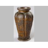 A FINE LARGE JAPANESE BRONZE VASE, the body with six lobed panels decorated in high relief with