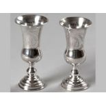 A NEAR PAIR OF EDWARDIAN SILVER KIDDUSH CUPS, LONDON 1902 & 1903, S.K., fold-over rims, body pin-