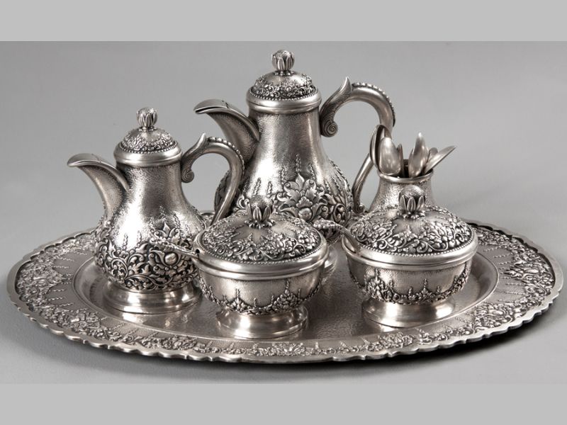 A DJOKJA .800STD SILVER TEA AND COFFEE SERVICE, comprising; coffee pot, tea pot, sugar basin with