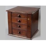 AN EARLY VICTORIAN MAHOGANY MINIATURE WELLINGTON CHEST, the moulded square top above four drawers