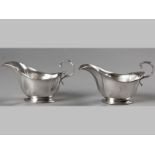 A PAIR OF GEORGE V SILVER SAUCE BOATS, BIRMINGHAM 1935, ADIE BROTHERS, with applied scroll handle,